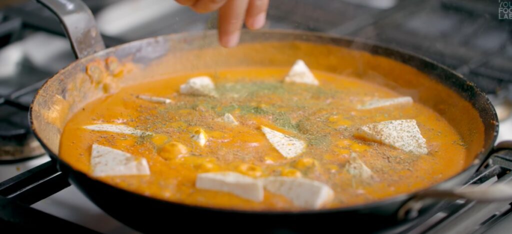 Paneer cooking in creamy Shahi Paneer gravy